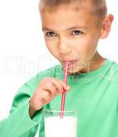 Cute little boy with a glass of milk