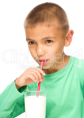 Cute little boy with a glass of milk