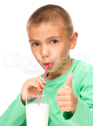 Cute little boy with a glass of milk