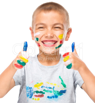 Portrait of a cute boy playing with paints Portrait of a cute boy playing with paints