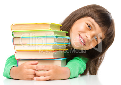 Little girl with her books