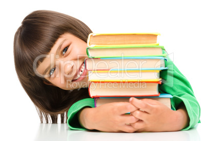 Little girl with her books