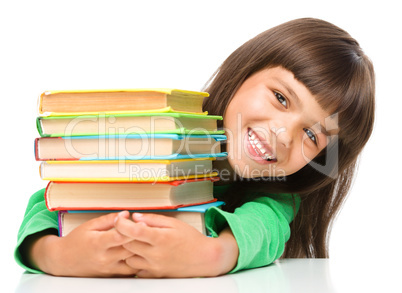 Little girl with her books