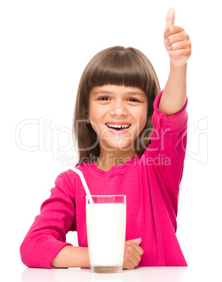 Cute little girl with a glass of milk