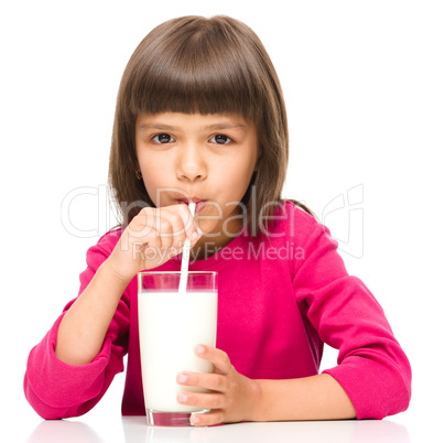 Cute little girl with a glass of milk