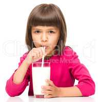 Cute little girl with a glass of milk