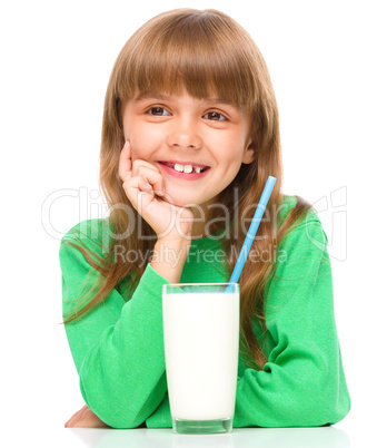 Cute little girl with a glass of milk