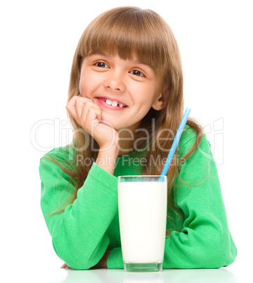 Cute little girl with a glass of milk