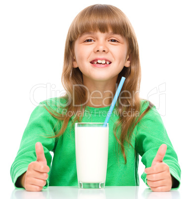 Cute little girl with a glass of milk