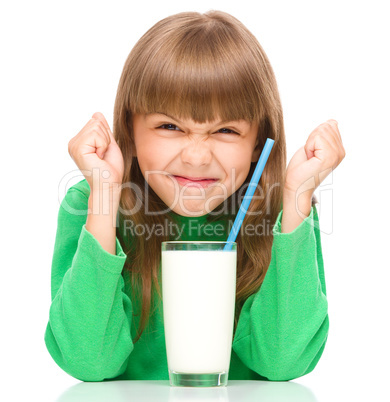 Little girl with a glass of milk