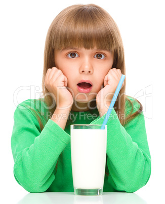 Cute little girl with a glass of milk