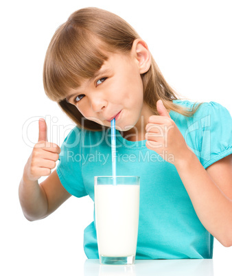 Cute little girl with a glass of milk