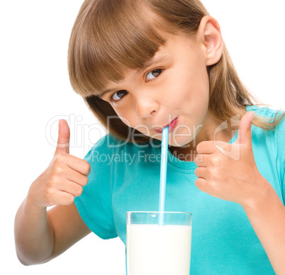 Cute little girl with a glass of milk