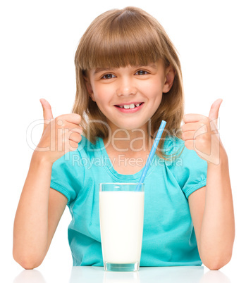 Cute little girl with a glass of milk