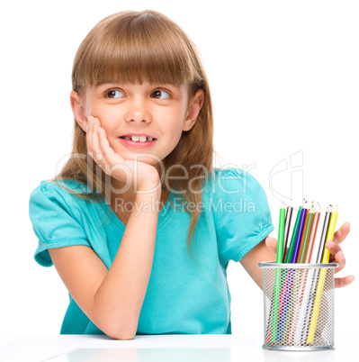 Little girl with color pencils