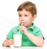Cute little boy with a glass of milk