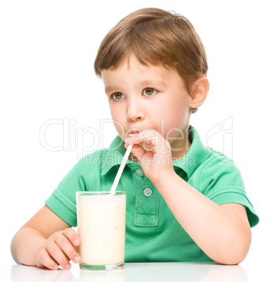 Cute little boy with a glass of milk