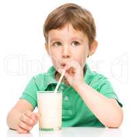 Cute little boy with a glass of milk