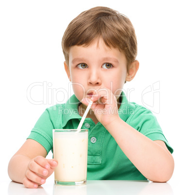 Cute little boy with a glass of milk