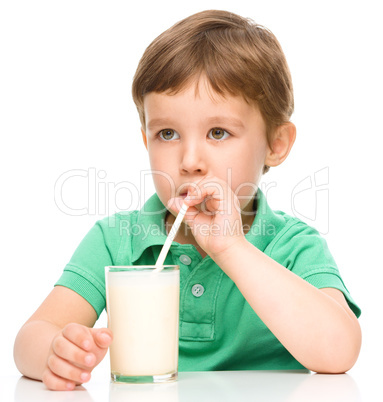 Cute little boy with a glass of milk