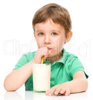 Cute little boy with a glass of milk