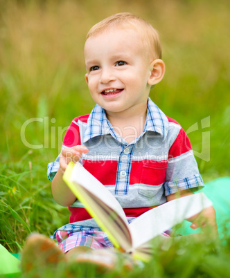 Little boy is reading book