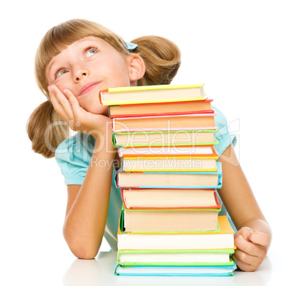 Little girl with books