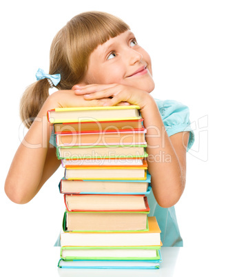 Little girl with books