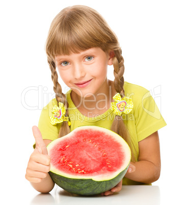 Little girl is eating watermelon