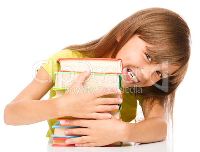 Little girl with her books