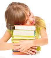 Little girl with her books