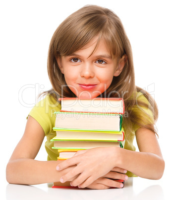 Little girl with her books