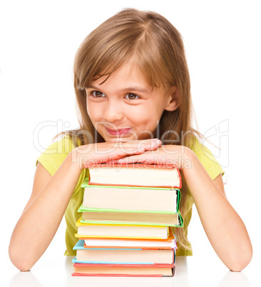 Little girl with her books