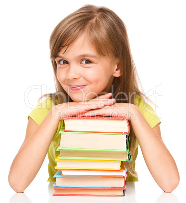 Little girl with her books