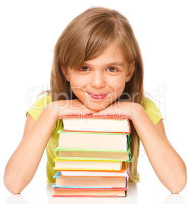 Little girl with her books