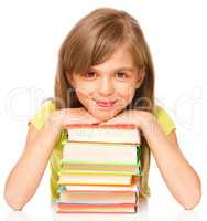 Little girl with her books