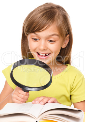 Little girl is reading book