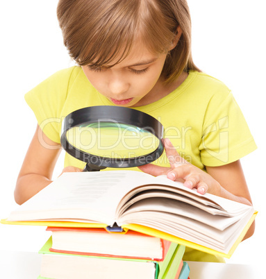 Little girl is reading book