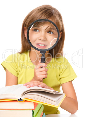 Little girl is reading book