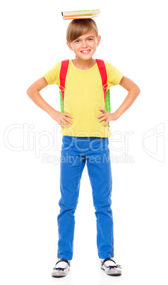 Portrait of a cute little schoolgirl with backpack