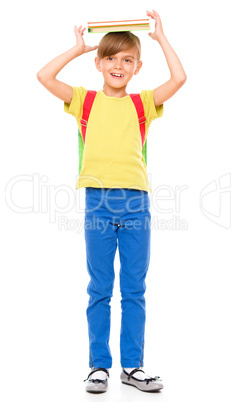 Portrait of a cute little schoolgirl with backpack