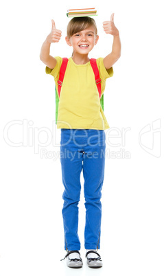 Portrait of a cute little schoolgirl with backpack