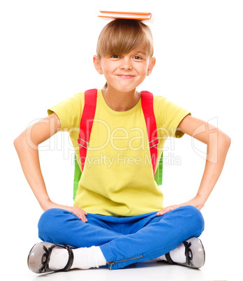 Portrait of a cute little schoolgirl with backpack