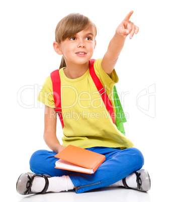 Little girl with her books