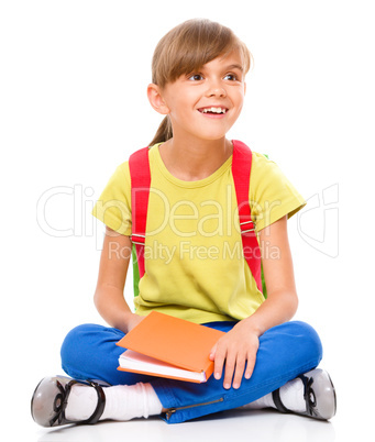 Portrait of a cute little schoolgirl with backpack