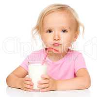 Cute little girl with a glass of milk