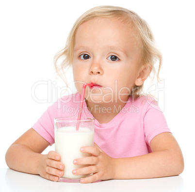 Cute little girl with a glass of milk