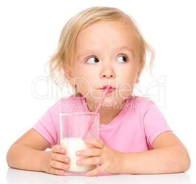 Cute little girl with a glass of milk