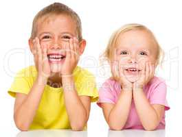 Portrait of a cute little girl and boy