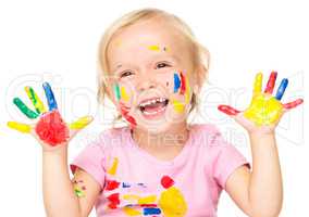 Portrait of a cute little girl playing with paints